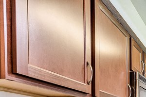 Spacious kitchen with espresso cabinets and dark granite countertop